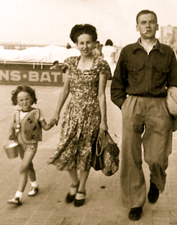 Belgium ca. 1948. Viviane and her parents on the walk board at the seaside.